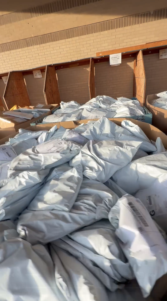 Large bins filled with poly-bagged, labeled units prepped at the Honeybee warehouse