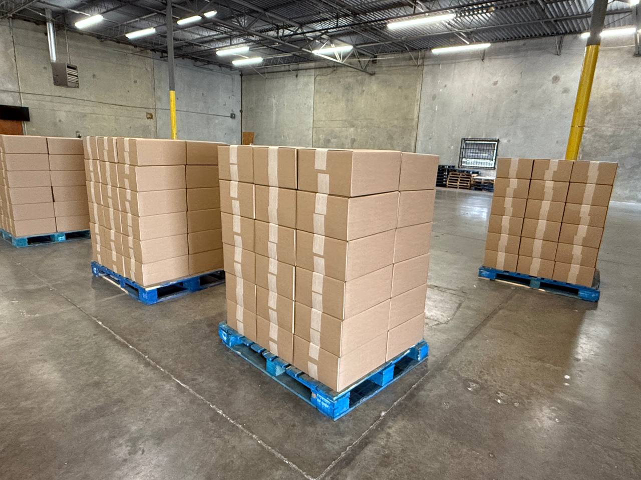 Neatly packed and labeled customer orders ready to ship from the Honeybee warehouse