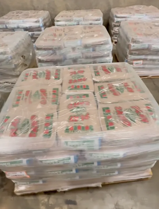 Pallets of heavy, shrink-wrapped bagged product handled by the Honeybee team