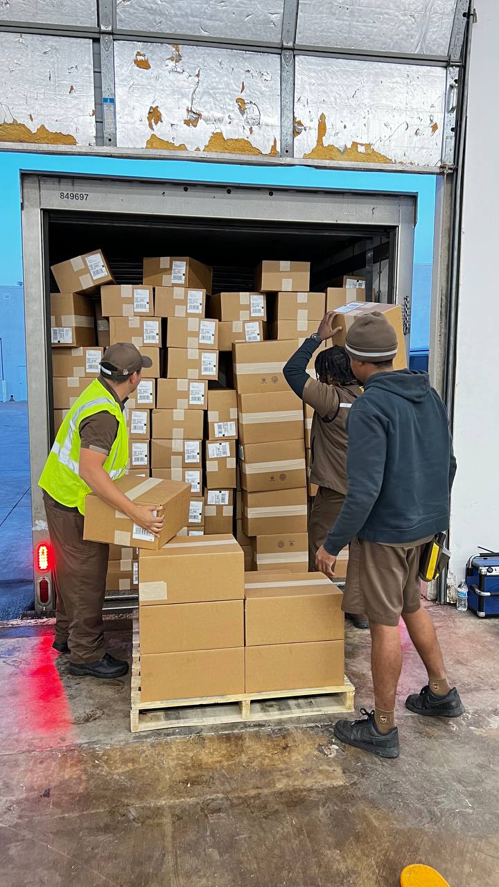 Honeybee team loading boxes onto a UPS truck